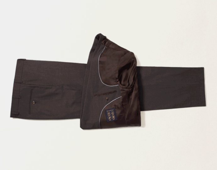 Visual instruction on how to fold a suit for packing