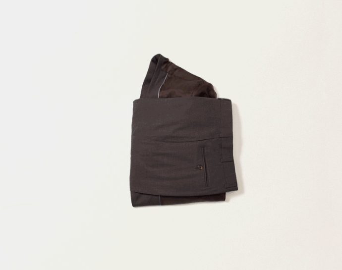 Visual instruction on how to fold a suit for packing