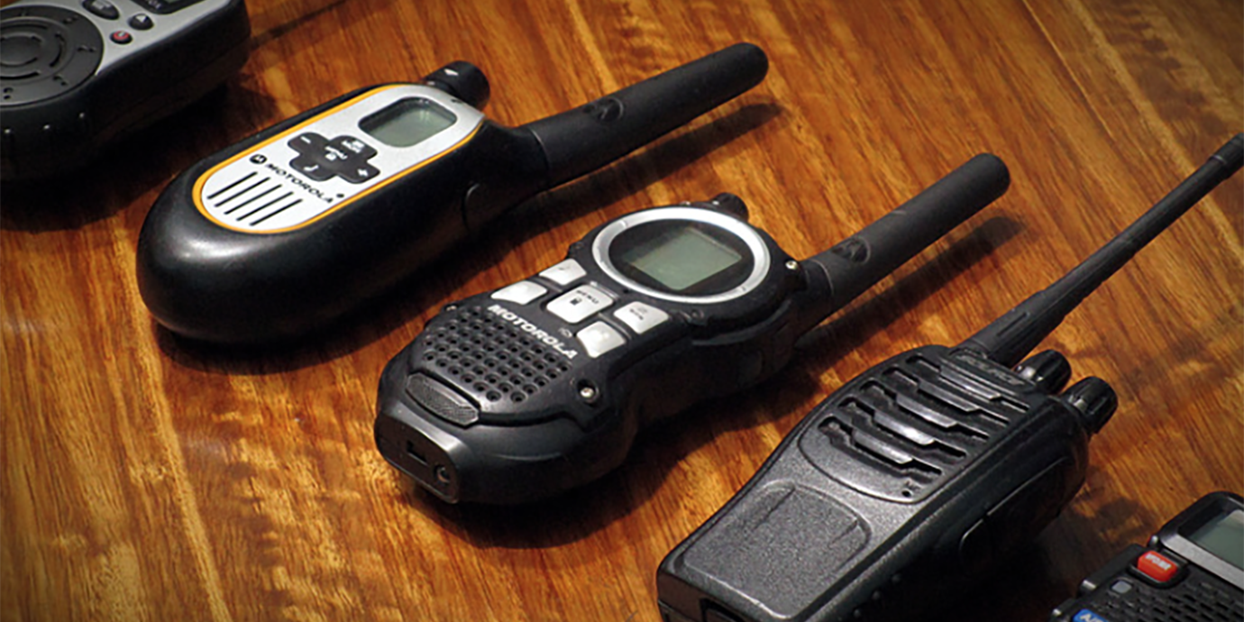 Array of walkie talkies on a table