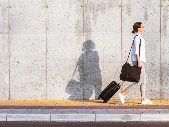 Marie Kondo - Minimalist Packing - Open and Shut Case - Women with Suitcase