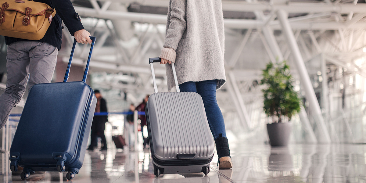 Perfect Luggage - Airport Couple Walking with Suitcases