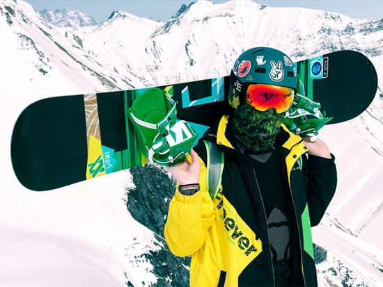 Man with Snowboard on Mountain