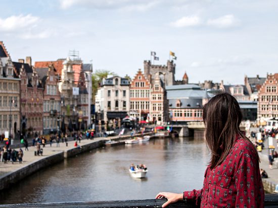 Woman in Amsterdam, looking at canal