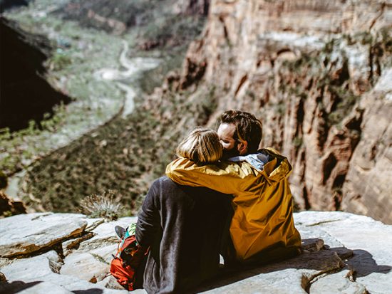 Couple Sitting on Mountain