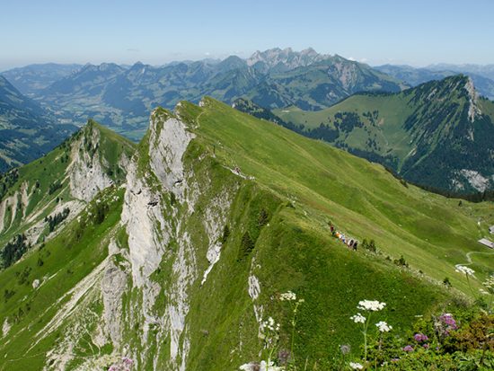 View of People Hiking Along a Ridge