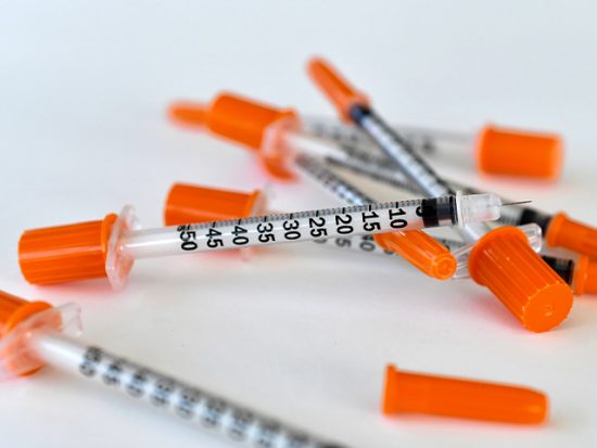 Insulin needles on a table.