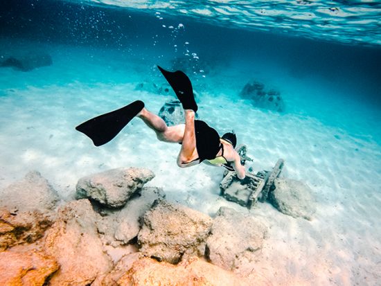 Man snorkeling with camera.