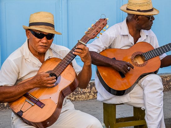 Two men playing guitar in Havana Cuba.