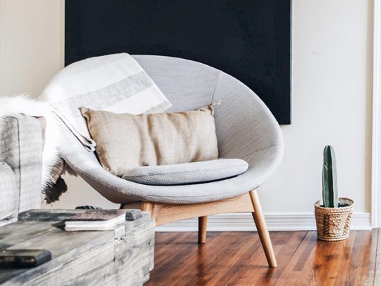 Chair in a neutral toned living room.