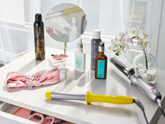 Dry Shampoo and other hair product on a vanity.
