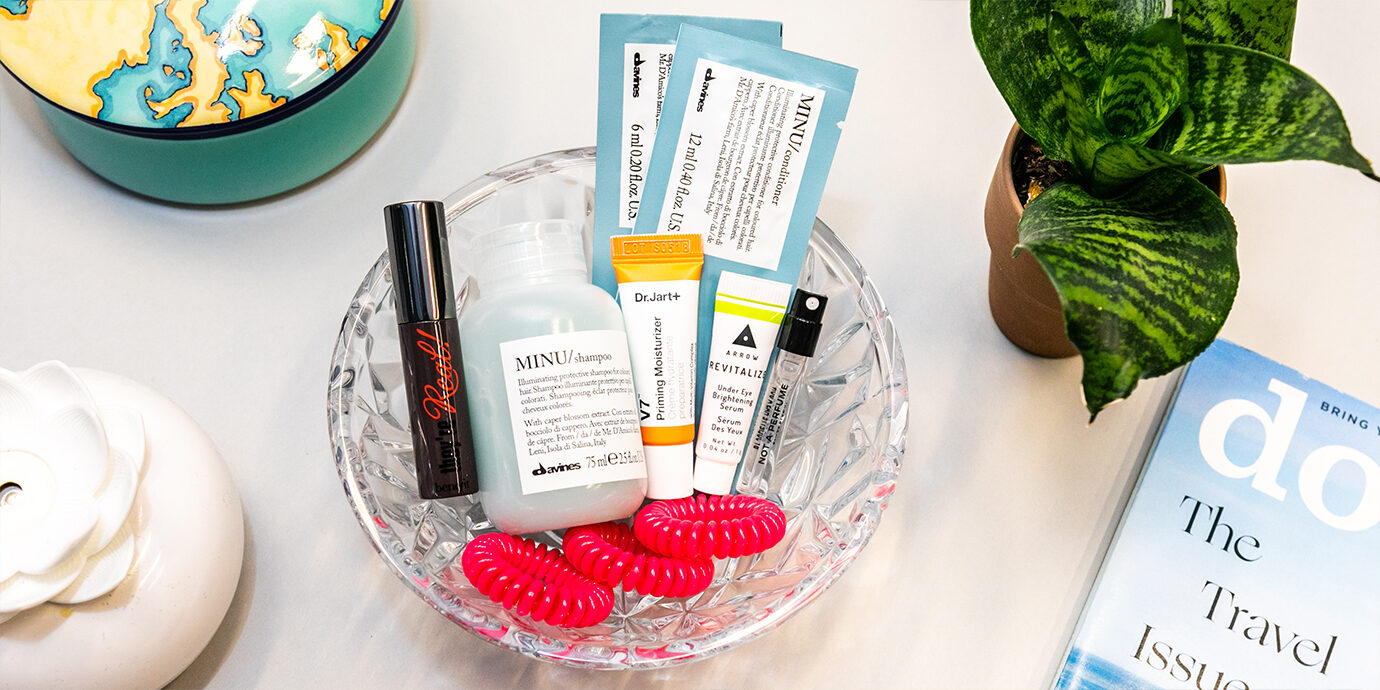Birchbox products in a glass bowl arranged.