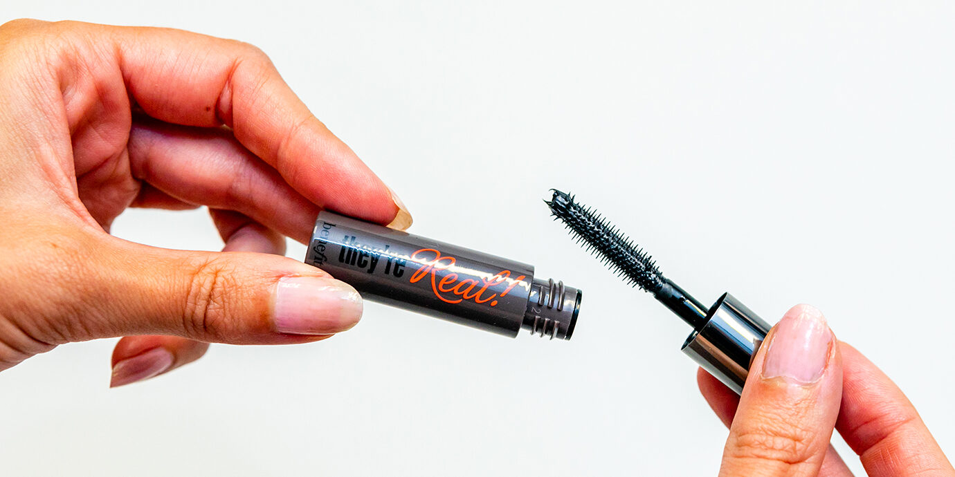 Holding up Birchbox Mascara from Benefit.