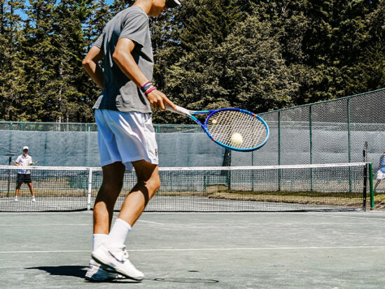 Man playing tennis.