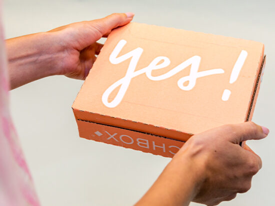 Person holding birchbox box from the mail.