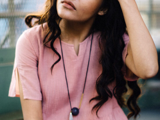 Woman in New Delhi wearing a pink dress.