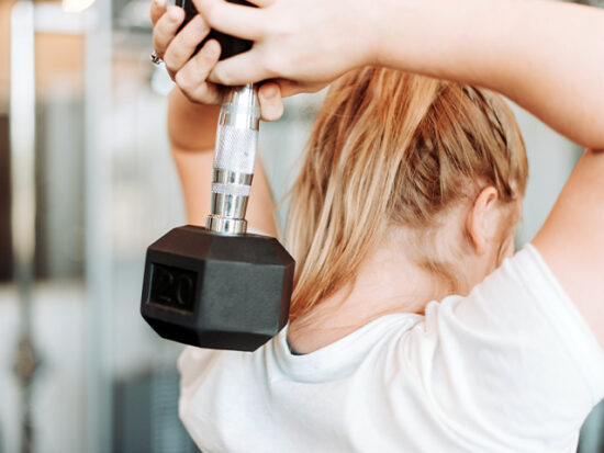 Woman working out with a weight.