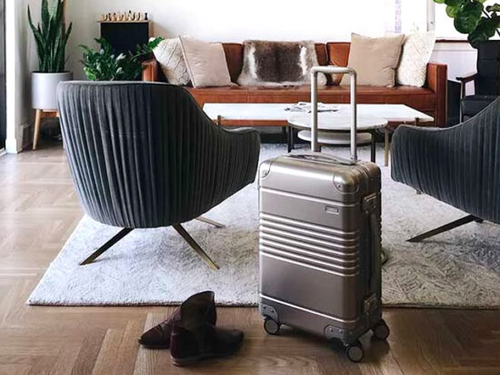 Arlo Skye Aluminum Carry-on in living room.