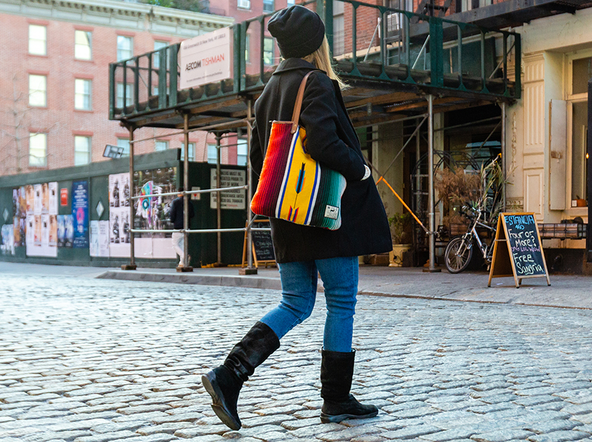 Anne walking down the street while wearing the boots.