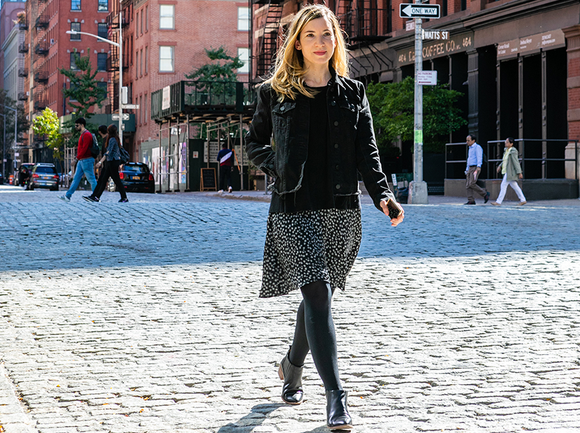 Anne walking down the street in NYC wearing a Rent the Runway dress.