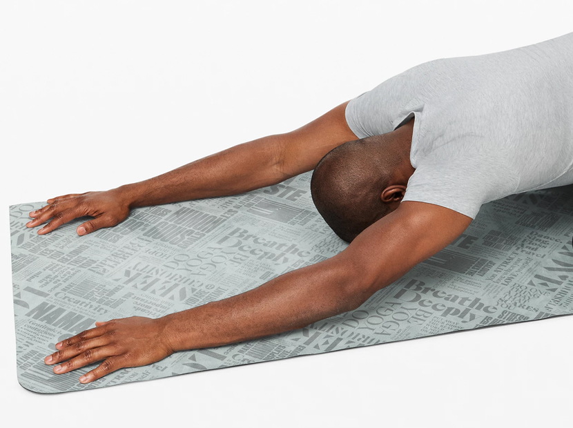 Man practicing yoga on a Lululemon Carry Onwards Mat.