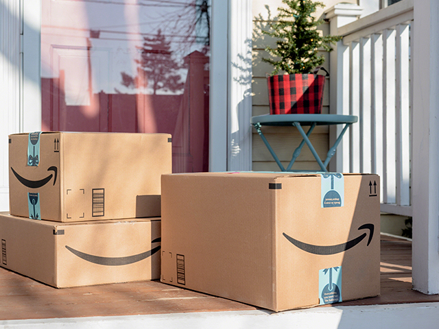 Amazon prime packages sitting on the front porch.