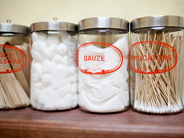 Jars holding medical supplies in a doctor's office.